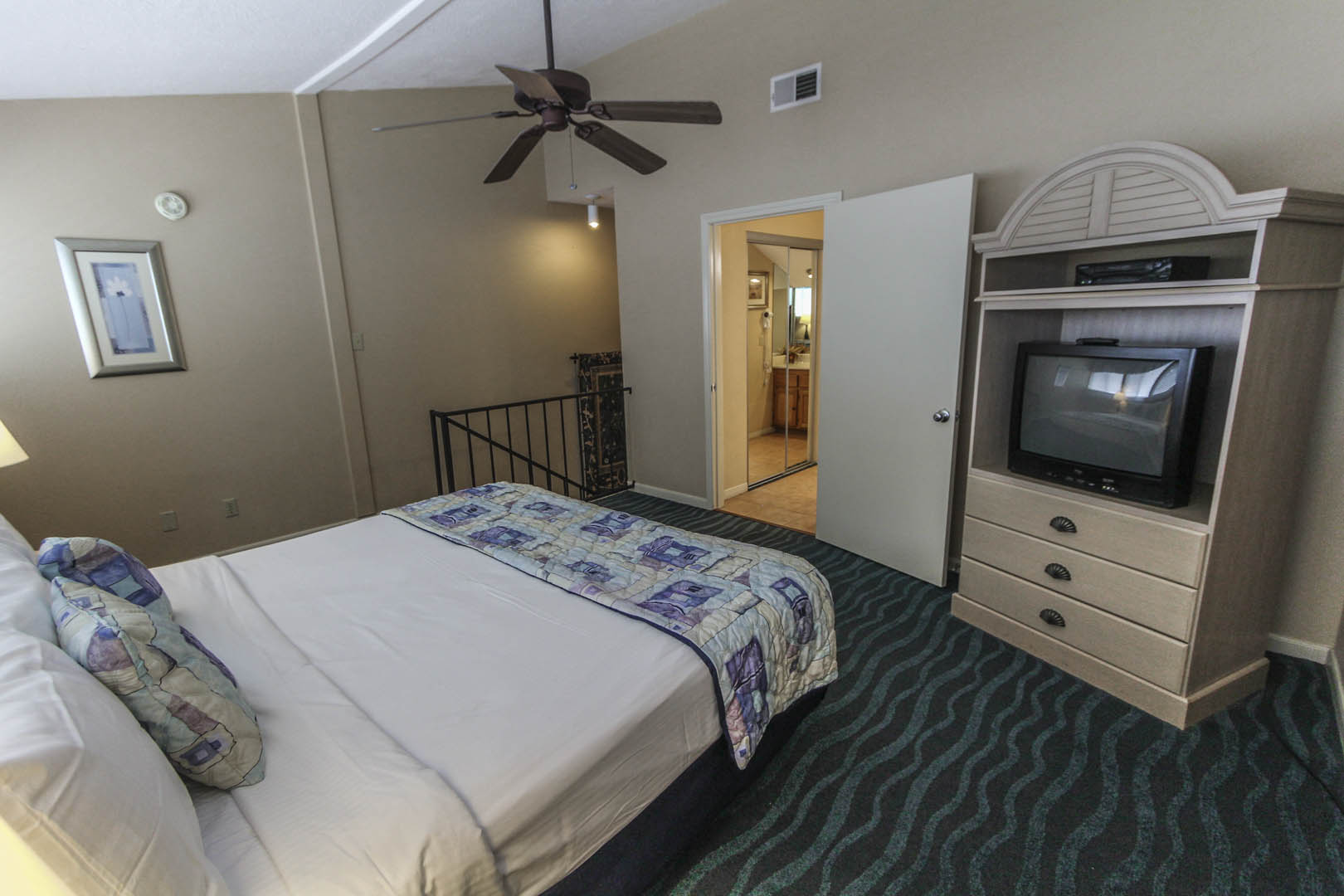A comfy bedroom at VRI's The Landing at Seven Coves in Willis, Texas.
